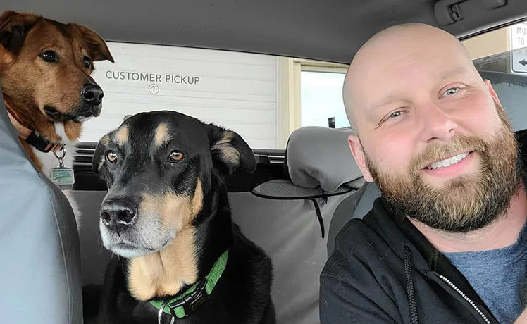 Trucker Josh and his dogs in his truck